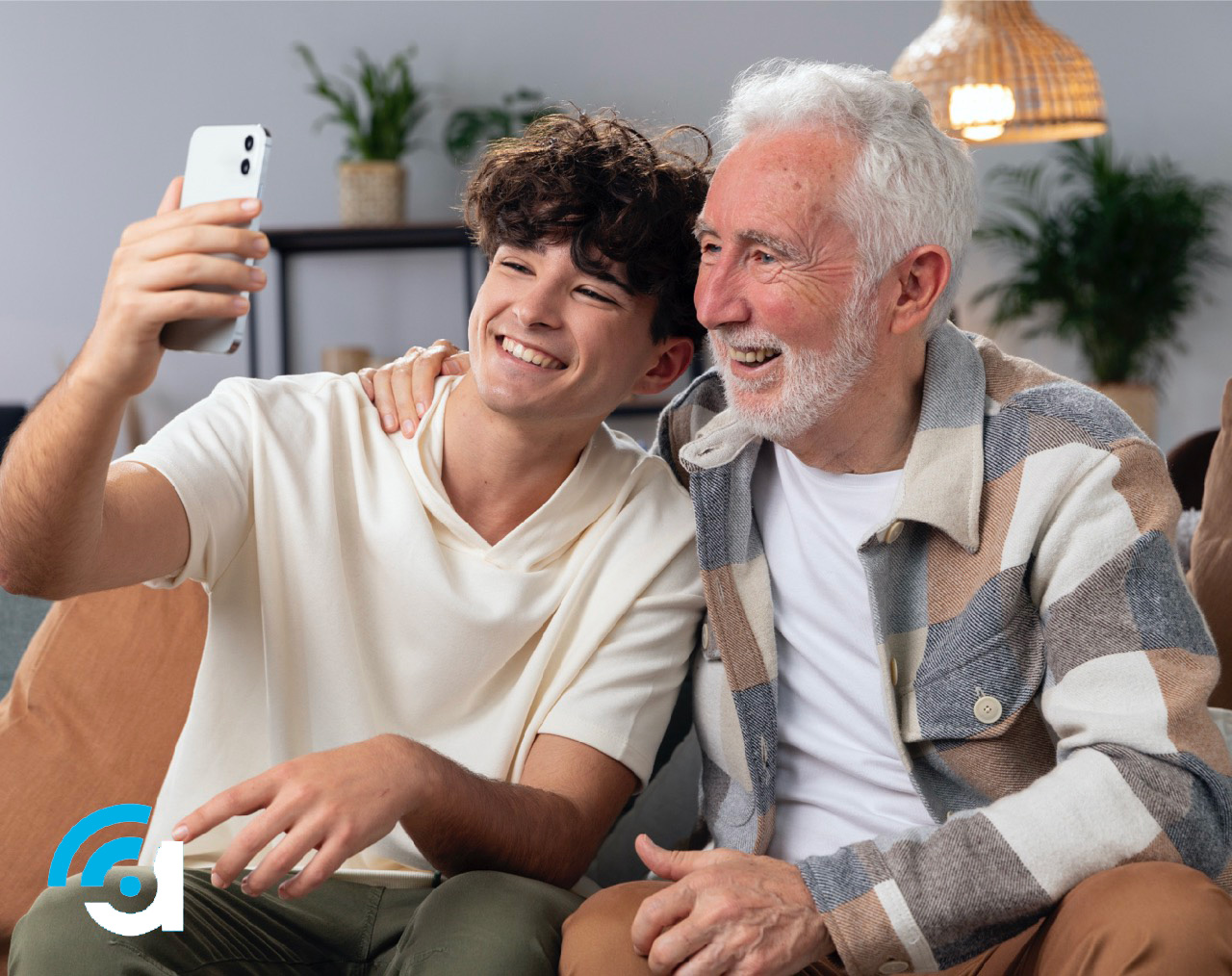 Young gentleman and senior man taking a picture together, smiling.